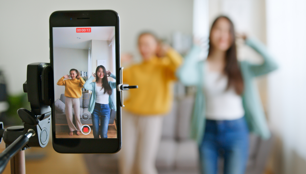 TikTok marketing agency strategy meeting with paid ads dashboard, creator content examples, TikTok Shop analytics, and campaign planning for business growth